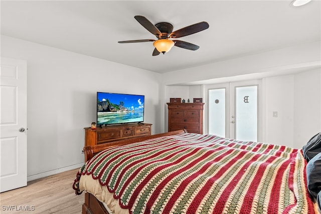 bedroom featuring ceiling fan and light hardwood / wood-style flooring