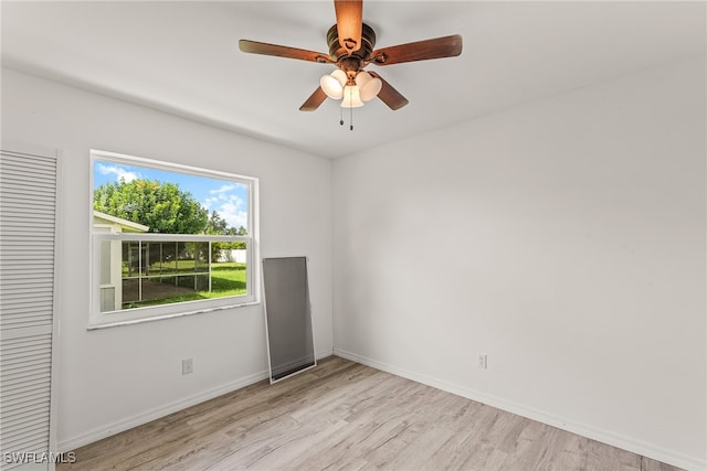 empty room featuring ceiling fan and light hardwood / wood-style floors