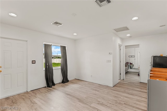 spare room with light wood-type flooring