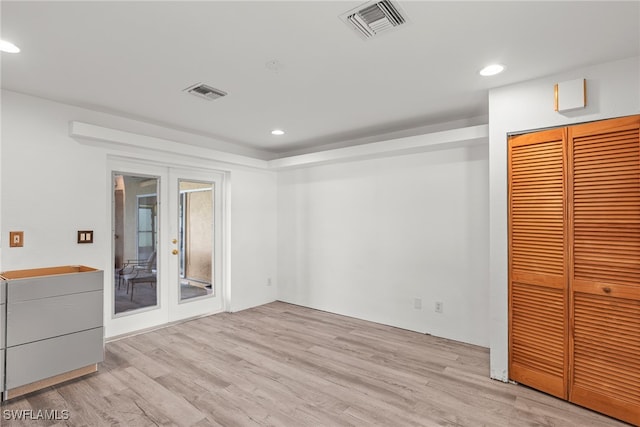 unfurnished room with light hardwood / wood-style floors