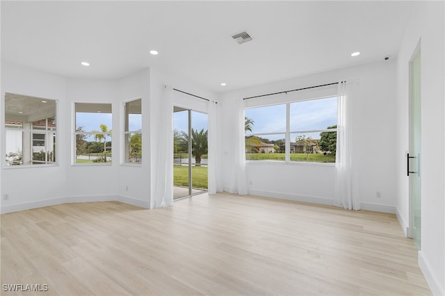 unfurnished room featuring light wood-type flooring