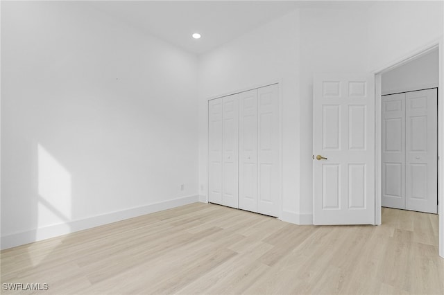 unfurnished bedroom featuring light wood-type flooring