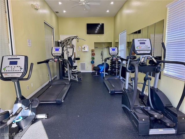 exercise room with ceiling fan