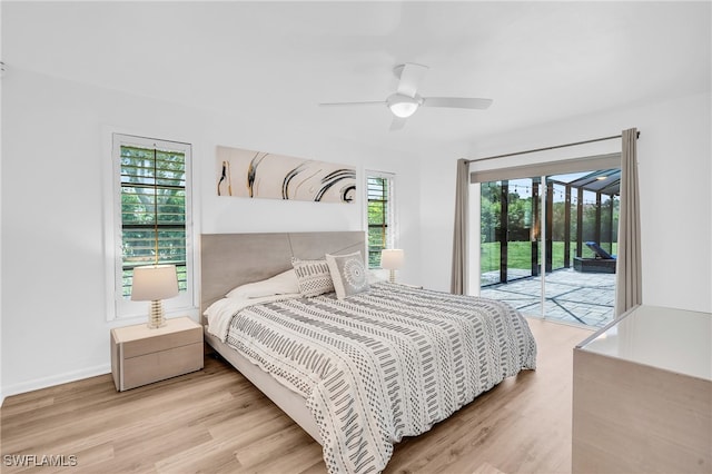 bedroom with light wood-type flooring, ceiling fan, and access to exterior