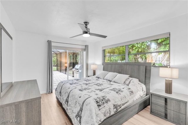 bedroom featuring access to exterior, ceiling fan, and light wood-type flooring