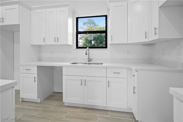 kitchen with white cabinets and sink