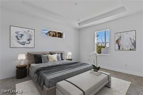 bedroom with a raised ceiling