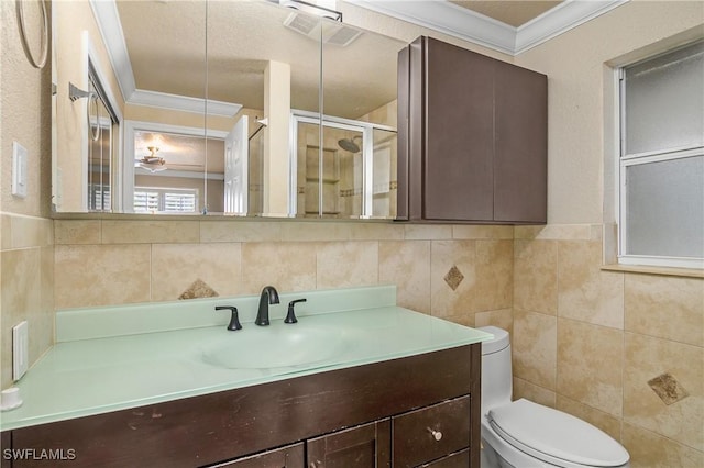 bathroom featuring visible vents, crown molding, tile walls, and vanity