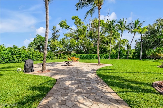 surrounding community featuring a yard and a patio area