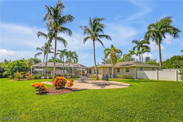 view of yard with a patio and a lanai