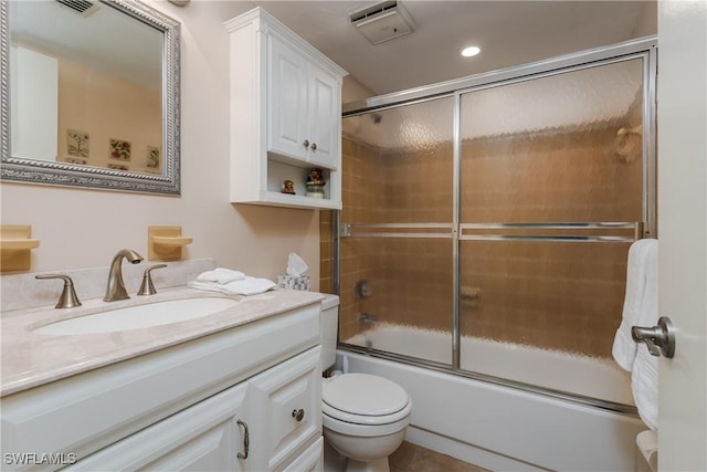 bathroom with shower / bath combination with glass door, recessed lighting, visible vents, toilet, and vanity