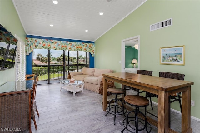 interior space featuring visible vents, wood ceiling, ornamental molding, wood finished floors, and vaulted ceiling