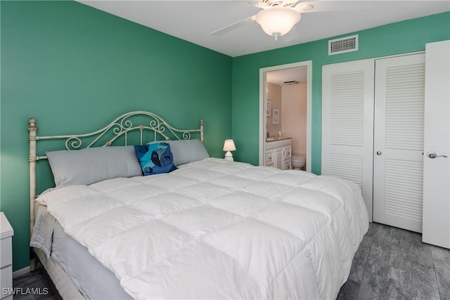 bedroom with a closet, visible vents, a ceiling fan, connected bathroom, and wood finished floors