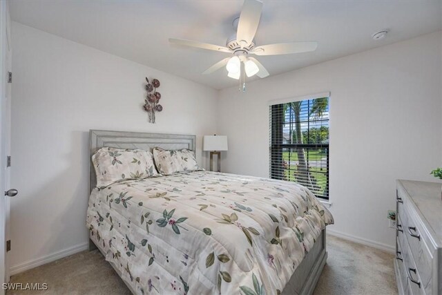 706 SW 9th Ct, Cape Coral, FL 33991 - bedroom featuring light colored carpet and a ceiling fan