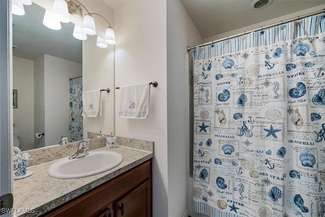 706 SW 9th Ct, Cape Coral, FL 33991 - bathroom with vanity and a shower with shower curtain