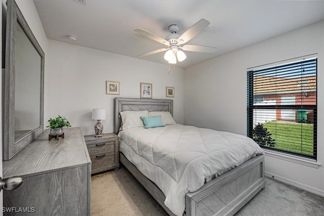 706 SW 9th Ct, Cape Coral, FL 33991 - bedroom with light carpet and a ceiling fan