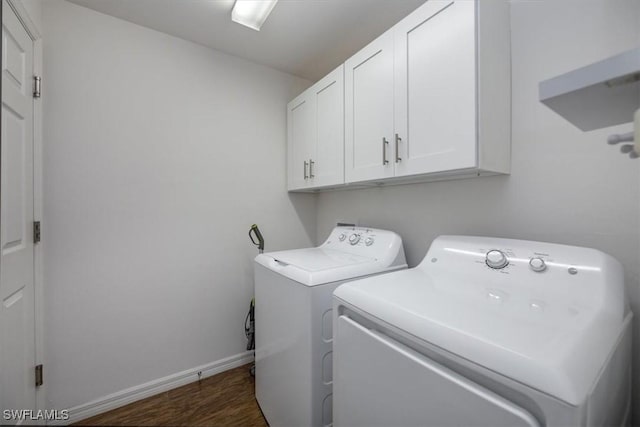 706 SW 9th Ct, Cape Coral, FL 33991 - laundry room with cabinet space, washer and dryer, and dark wood finished floors