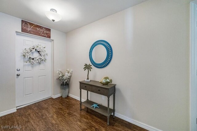 706 SW 9th Ct, Cape Coral, FL 33991 - entryway featuring dark wood-style floors and baseboards