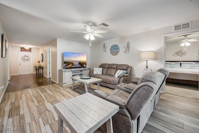 706 SW 9th Ct, Cape Coral, FL 33991 - living room with a ceiling fan and light wood-style flooring