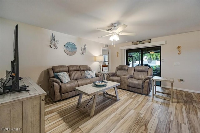 706 SW 9th Ct, Cape Coral, FL 33991 - living area with a ceiling fan and light wood-style floors