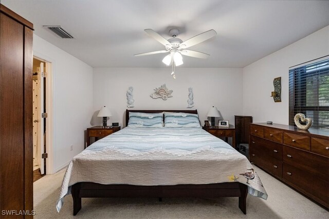 carpeted bedroom featuring ceiling fan