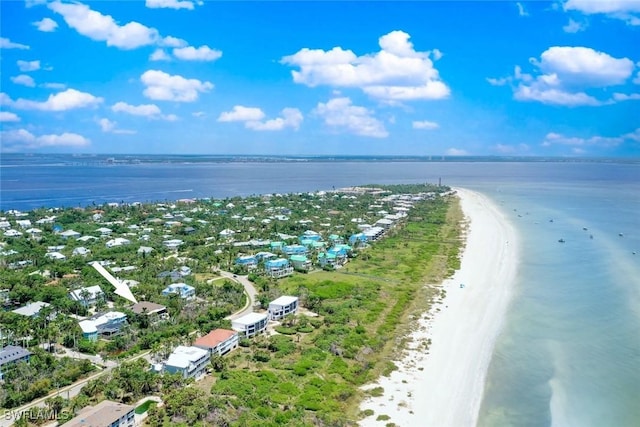 birds eye view of property with a water view and a view of the beach