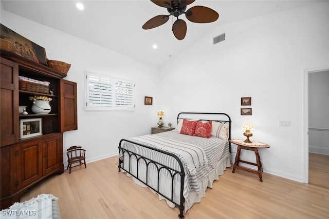 bedroom featuring ceiling fan, light hardwood / wood-style flooring, and vaulted ceiling