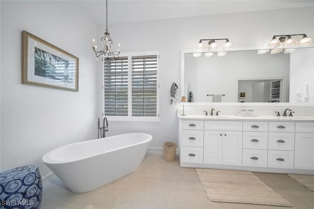 bathroom featuring vanity, tile patterned floors, and a bath