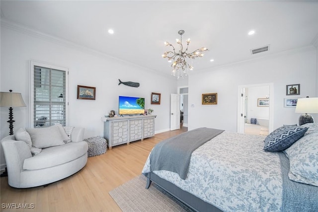 bedroom with ensuite bath, hardwood / wood-style floors, crown molding, and a notable chandelier