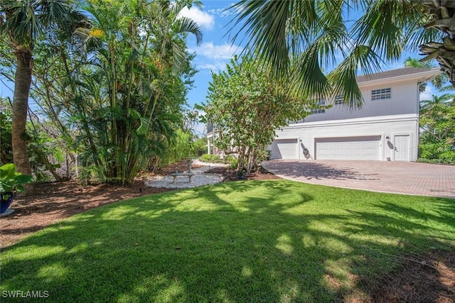 view of yard featuring a garage