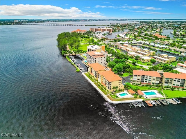 birds eye view of property with a water view