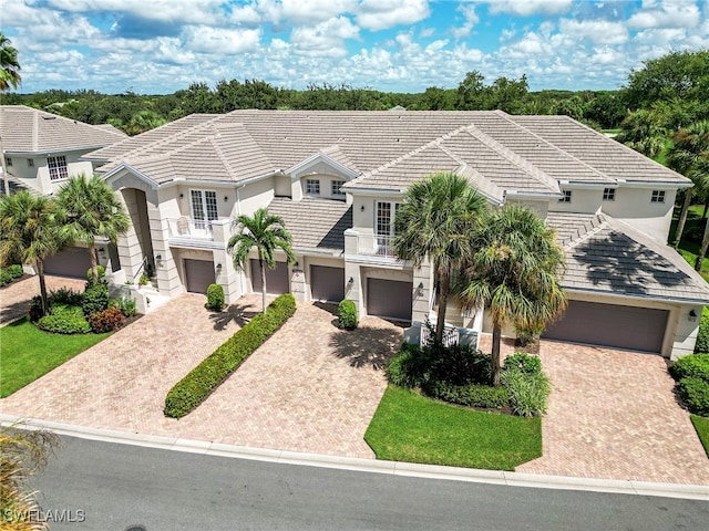 view of front of house with a balcony and a garage