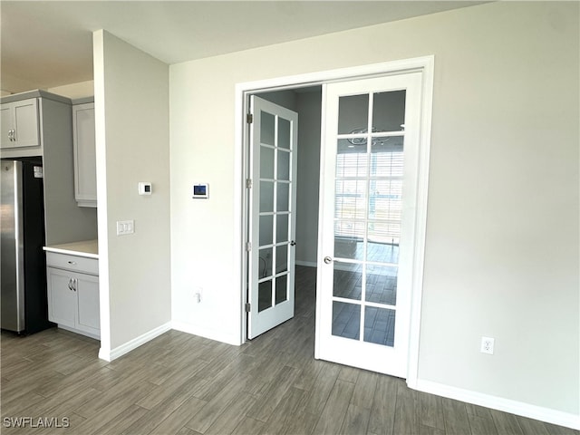 exterior space featuring dark hardwood / wood-style floors and french doors