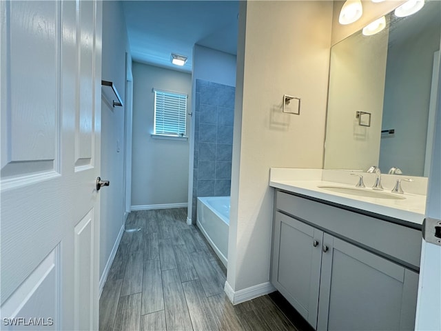 bathroom with hardwood / wood-style flooring and vanity