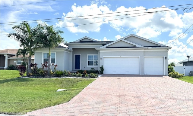 ranch-style home with a front lawn and a garage