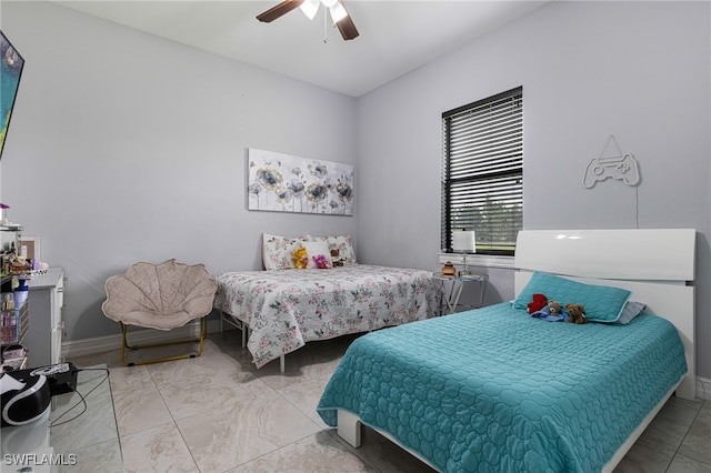 tiled bedroom with ceiling fan