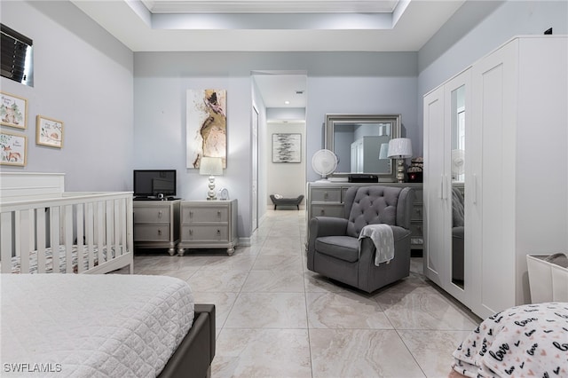 bedroom with light tile patterned floors and a crib