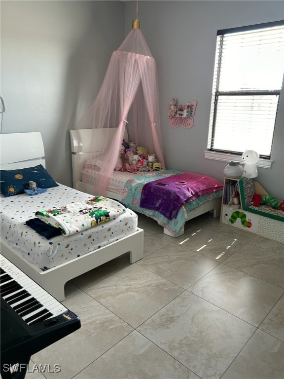 bedroom featuring light tile patterned floors