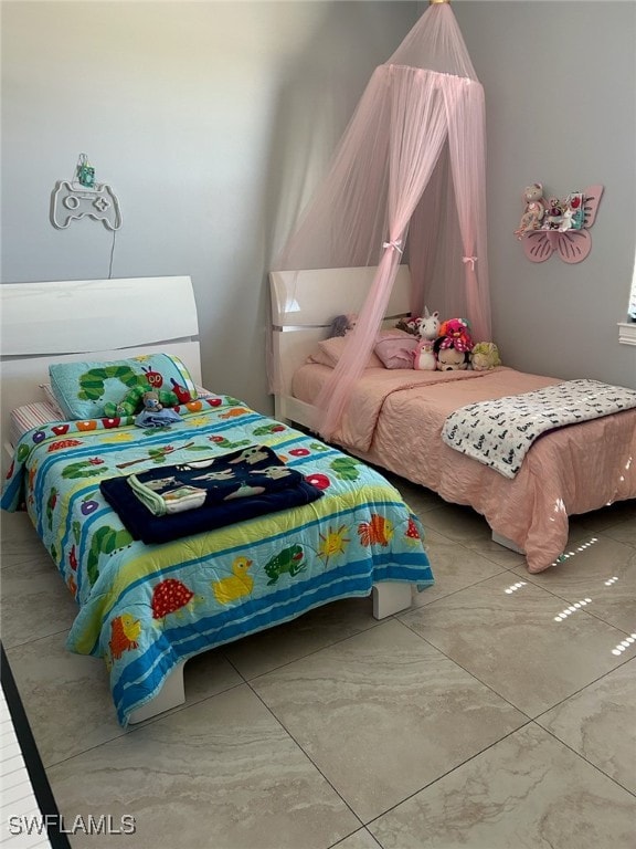 bedroom featuring light tile patterned flooring