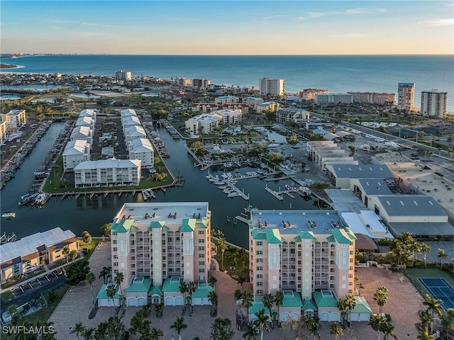 aerial view at dusk with a water view