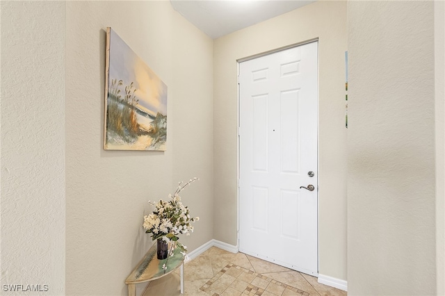 view of tiled foyer entrance