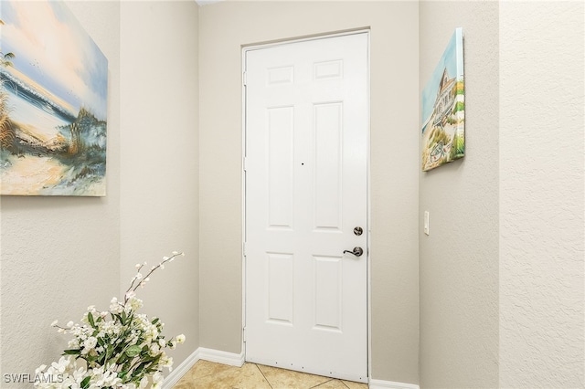 view of tiled foyer entrance