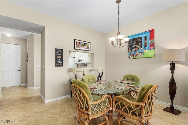 150 Lenell Rd Unit 503, Fort Myers Beach, FL 33931 - dining space featuring baseboards, light tile patterned flooring, and a notable chandelier
