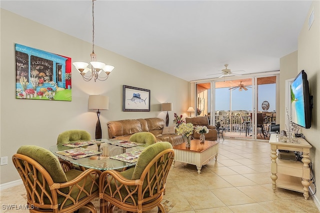 dining room featuring light tile patterned floors, ceiling fan with notable chandelier, and expansive windows