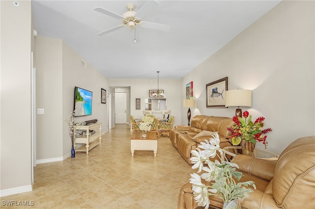 living room with light tile patterned flooring and ceiling fan