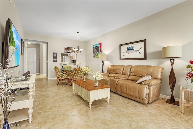 living room featuring light tile patterned floors and an inviting chandelier