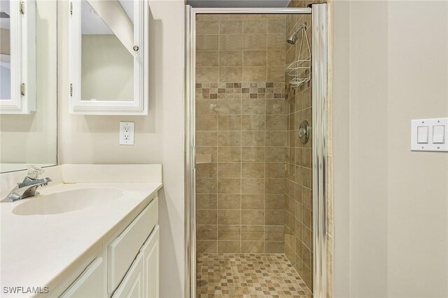 150 Lenell Rd Unit 503, Fort Myers Beach, FL 33931 - bathroom featuring vanity and a shower stall