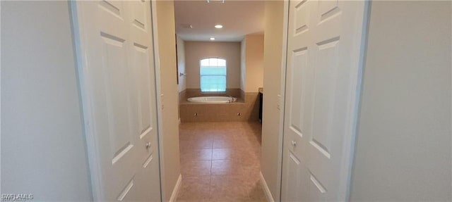 hallway with light tile patterned flooring