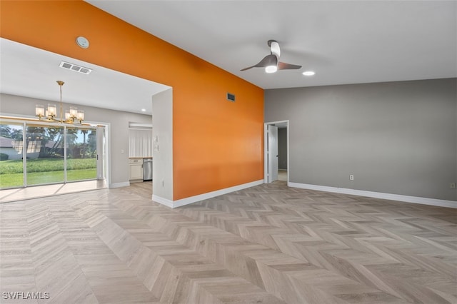 empty room featuring ceiling fan with notable chandelier and light parquet floors