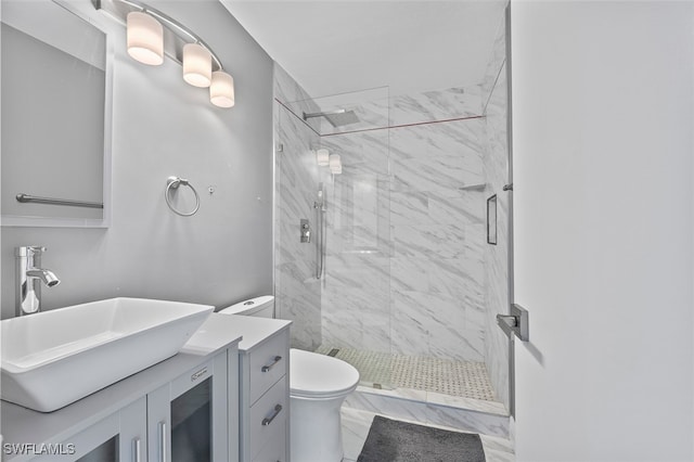 bathroom with vanity, toilet, and an enclosed shower